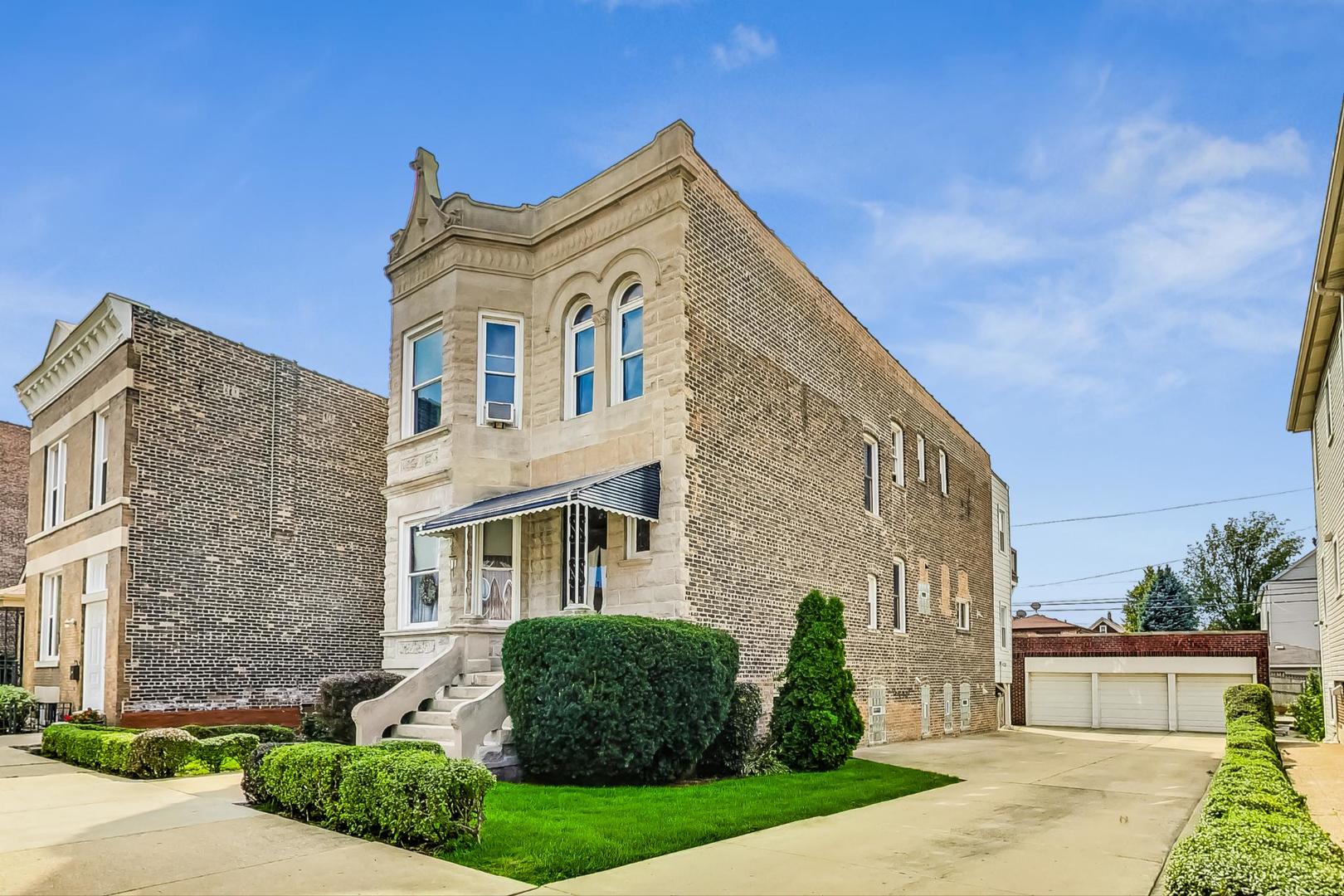 2954 South Loomis Street Chicago, IL 60608 - Photo 3 of 80 a front view of a house with garden