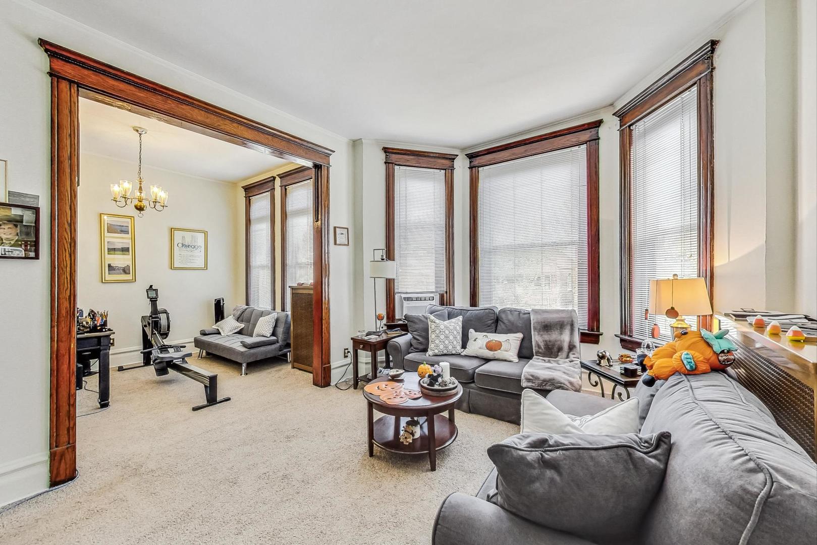 2954 South Loomis Street Chicago, IL 60608 - Photo 39 of 80 a living room with furniture and floor to ceiling windows