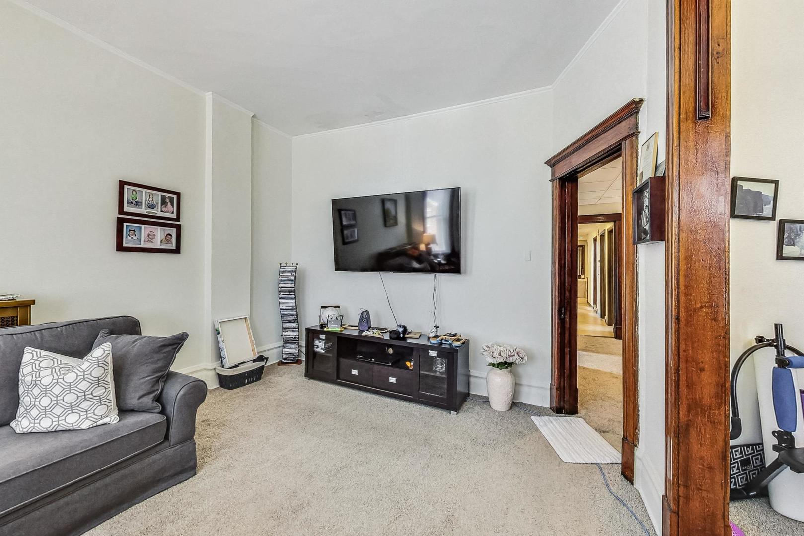 2954 South Loomis Street Chicago, IL 60608 - Photo 41 of 80 a living room with furniture and a flat screen tv