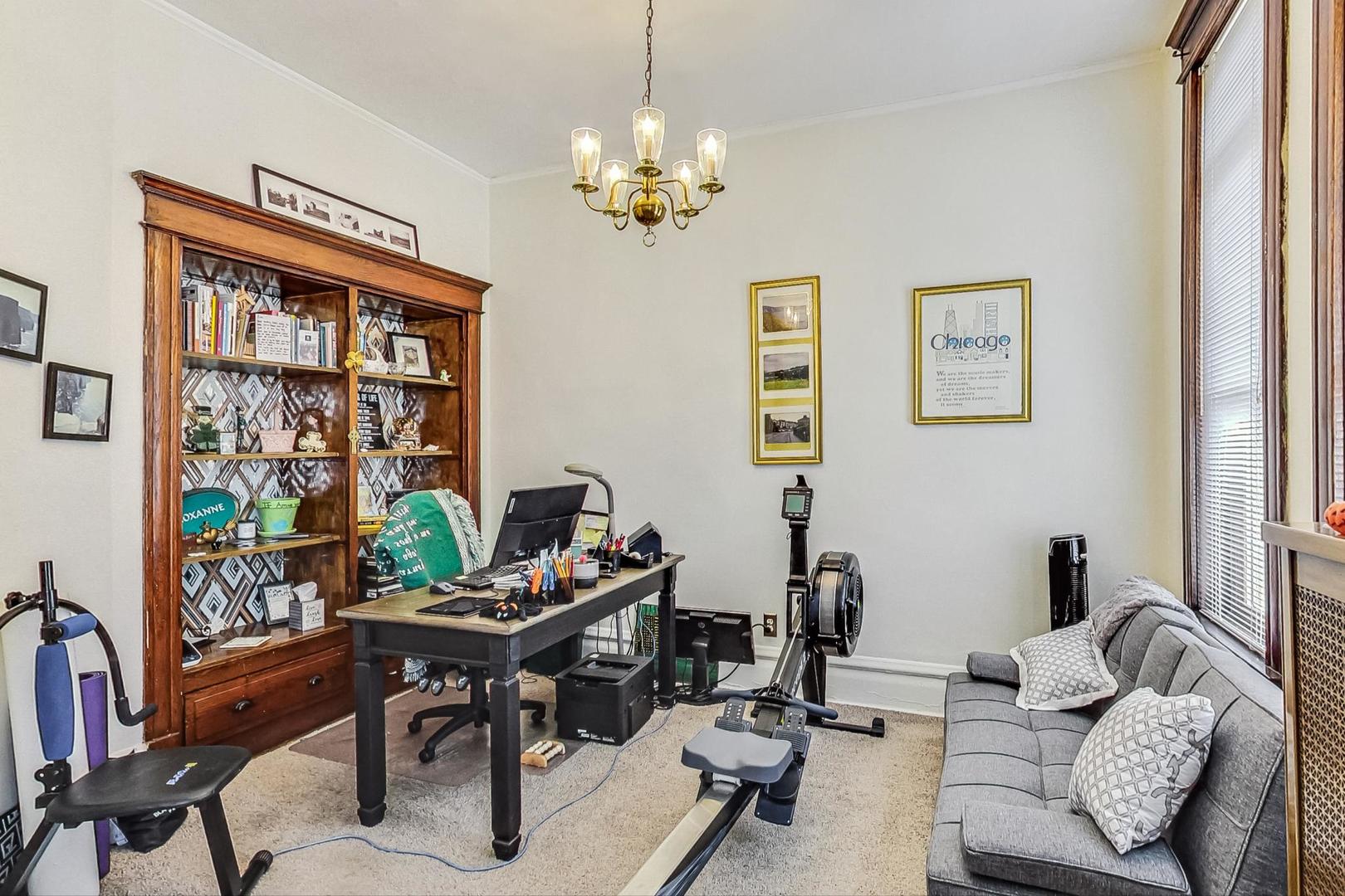 2954 South Loomis Street Chicago, IL 60608 - Photo 42 of 80 a living room with furniture and a chandelier