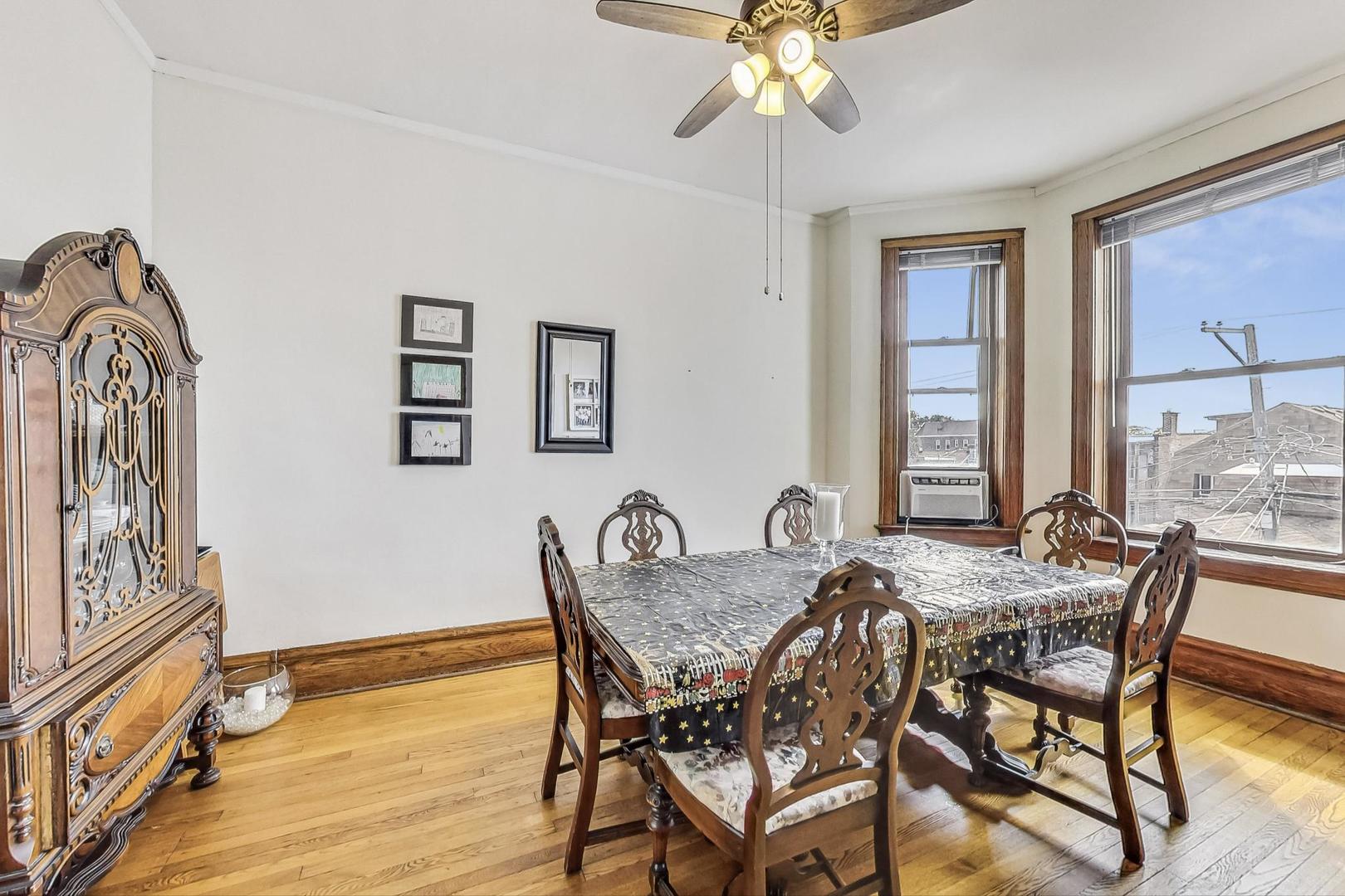 2954 South Loomis Street Chicago, IL 60608 - Photo 44 of 80 a view of a dining room with furniture and wooden floor