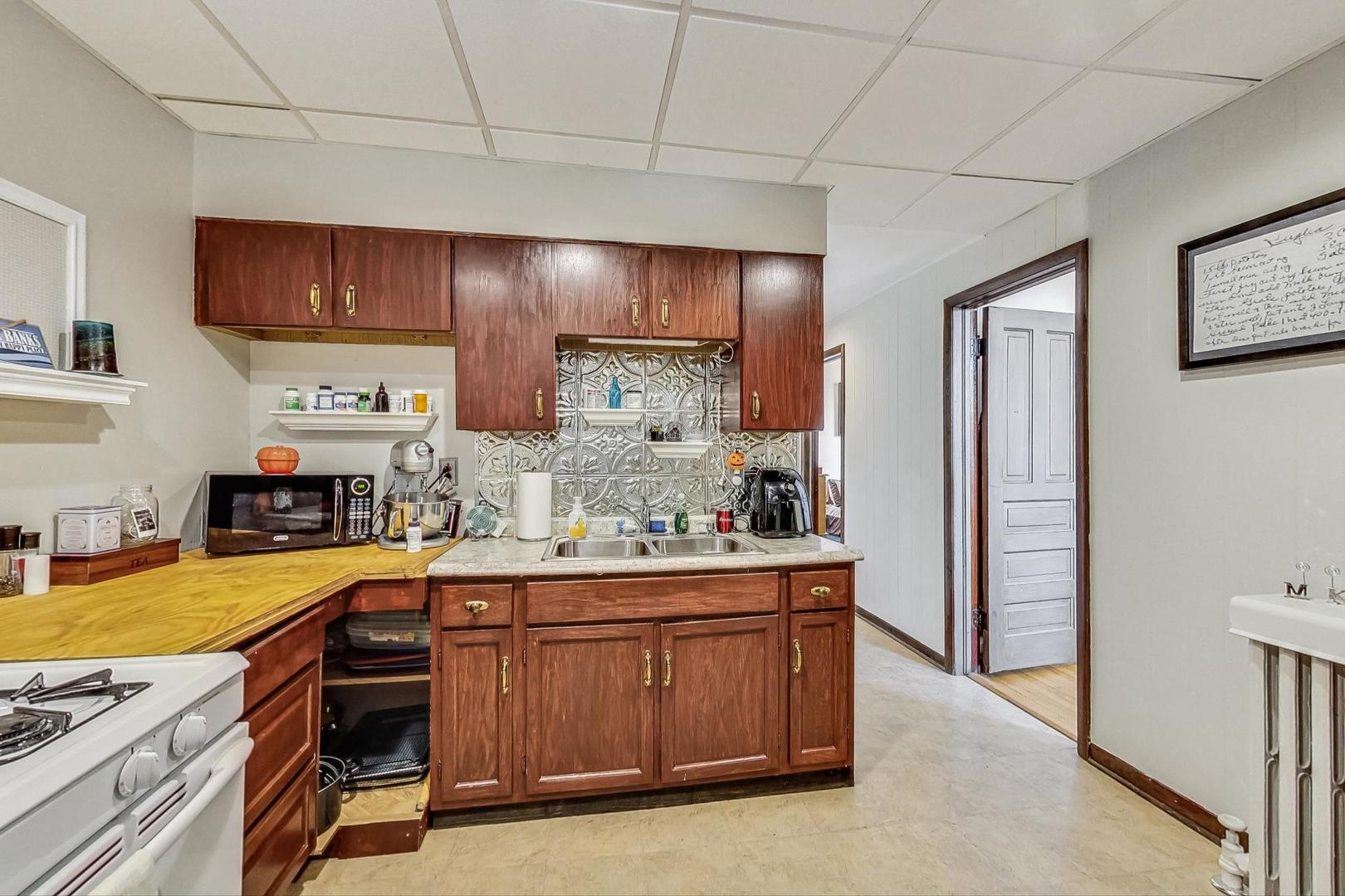 2954 South Loomis Street Chicago, IL 60608 - Photo 49 of 80 a kitchen with stainless steel appliances a stove and a refrigerator
