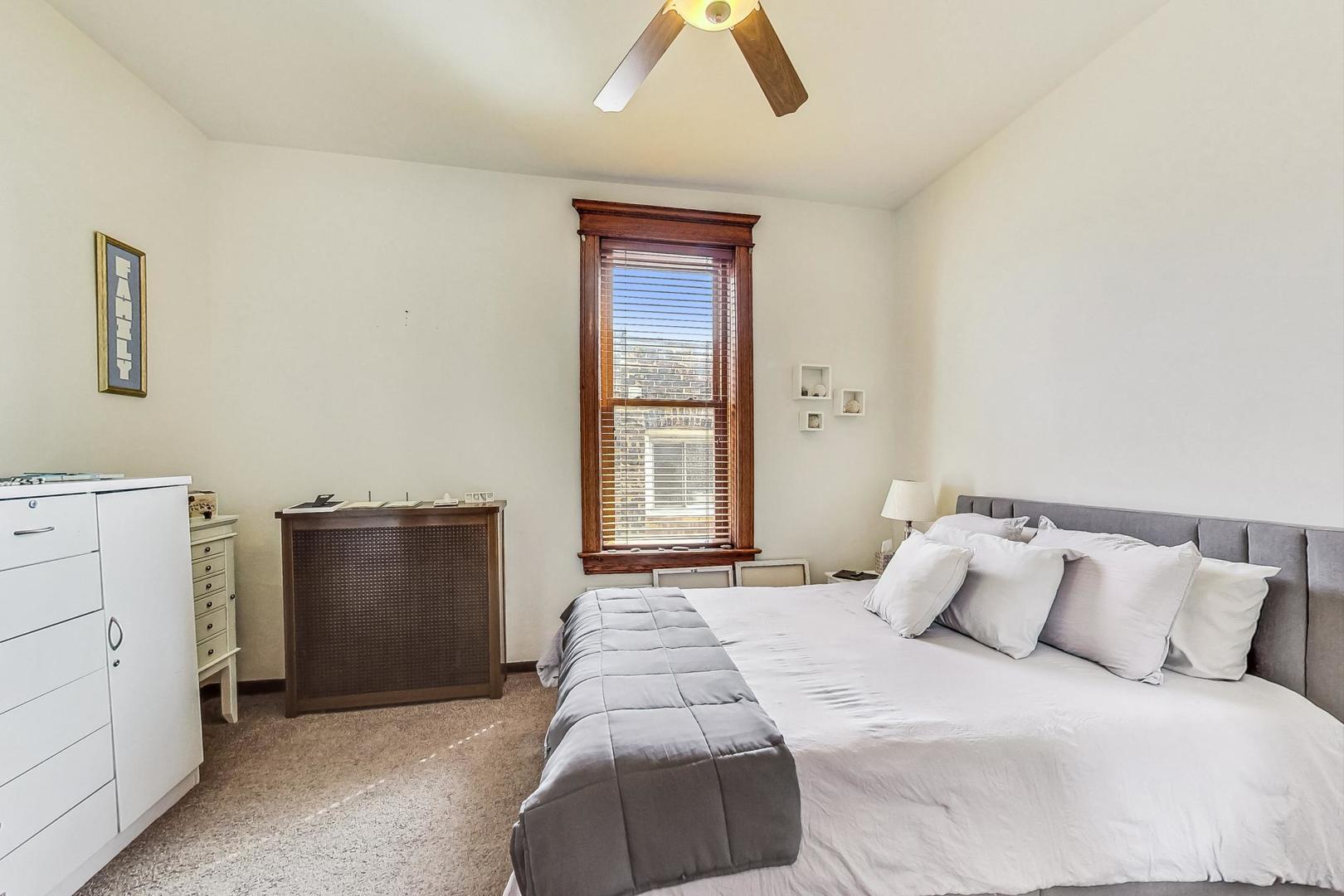 2954 South Loomis Street Chicago, IL 60608 - Photo 51 of 80 a bedroom with a bed and a window