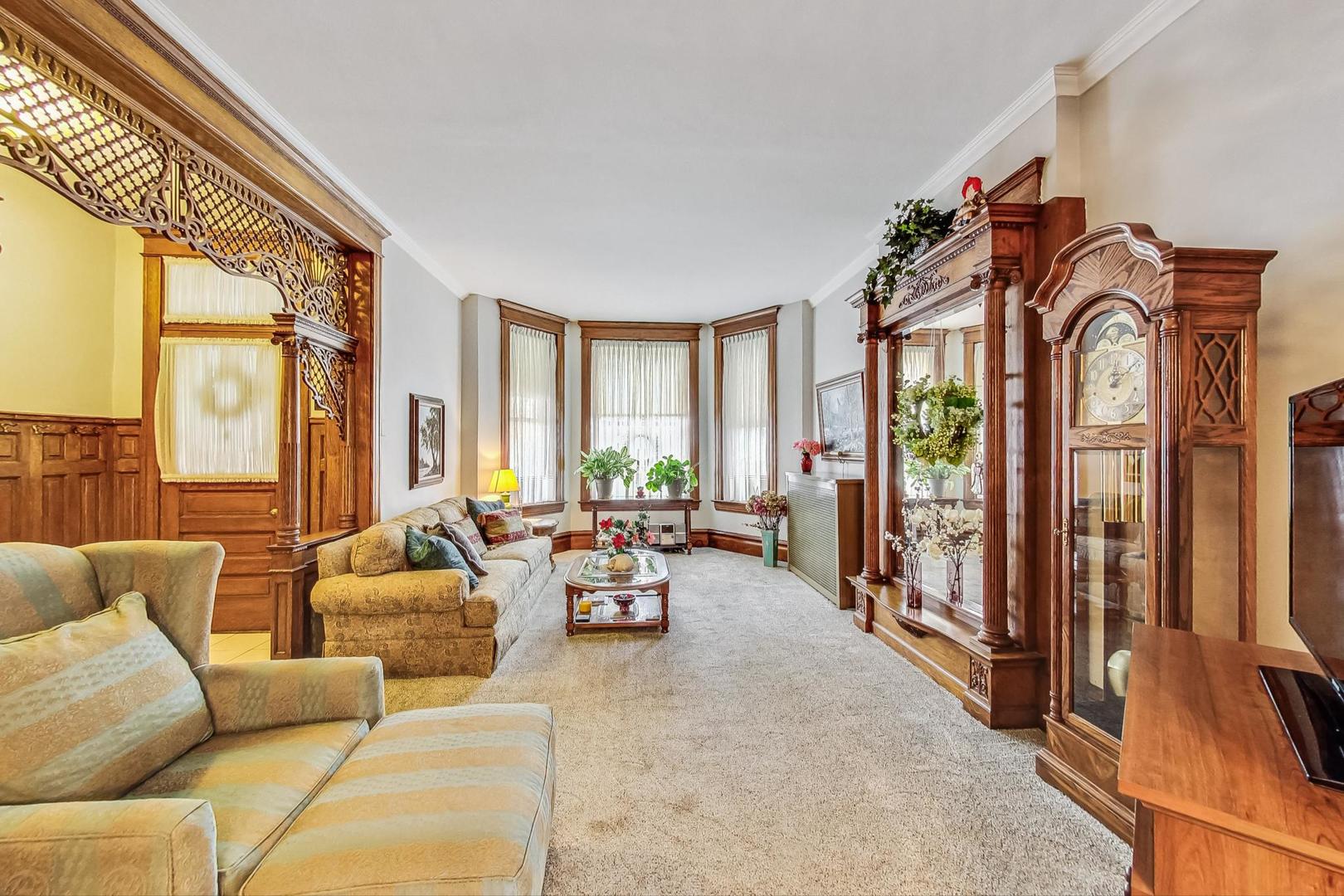 2954 South Loomis Street Chicago, IL 60608 - Photo 10 of 80 a living room with furniture fireplace and a large window