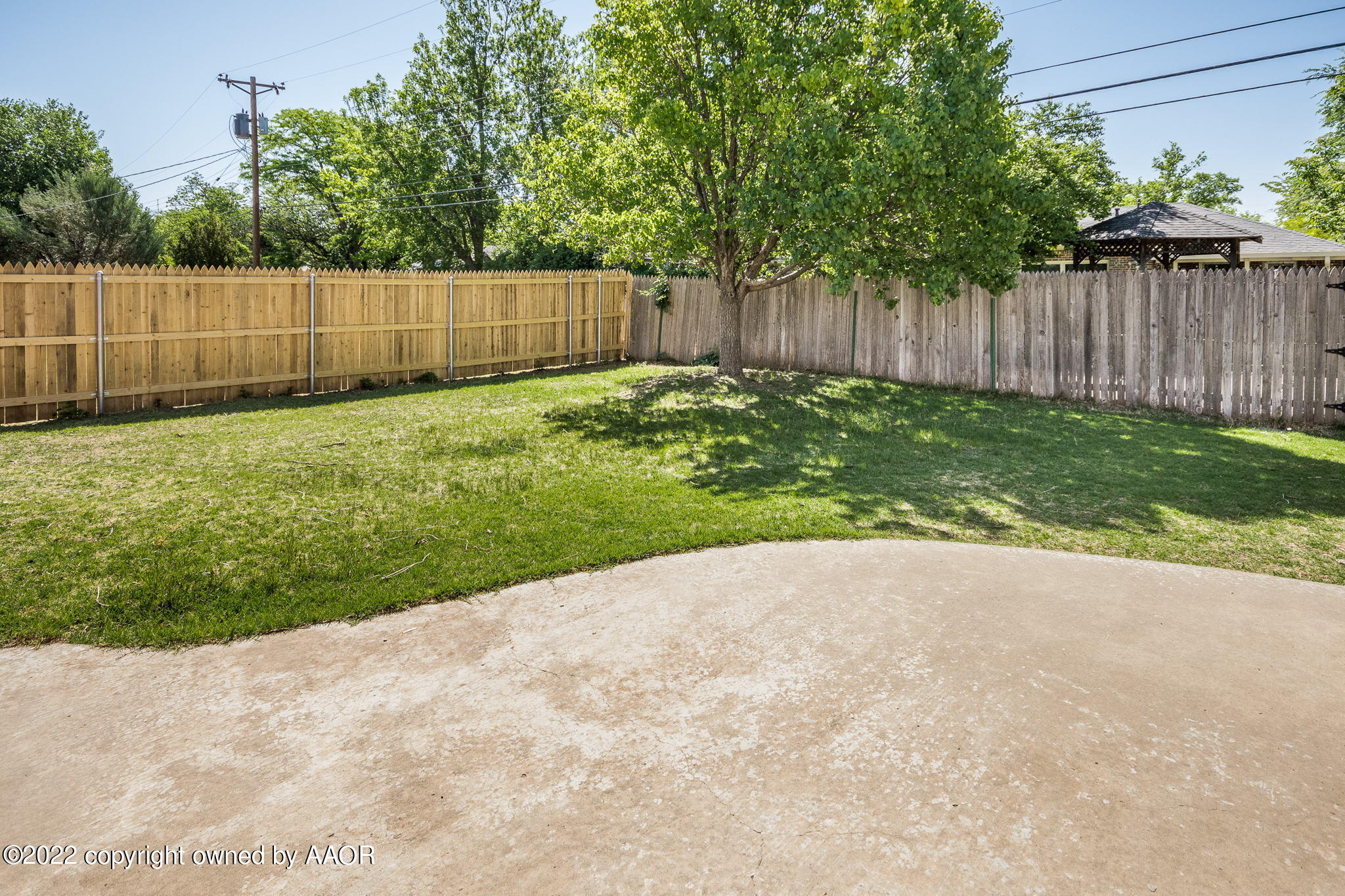6107 Gainsborough Road Amarillo, TX 79106 - Photo 18 of 23 a view of backyard with tree