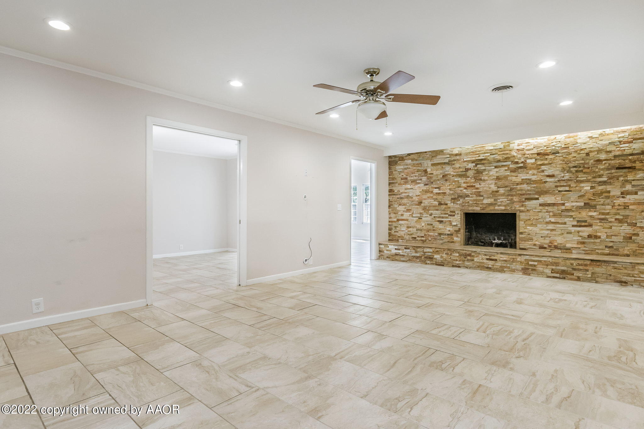 6107 Gainsborough Road Amarillo, TX 79106 - Photo 6 of 23 a view of an empty room with a fireplace