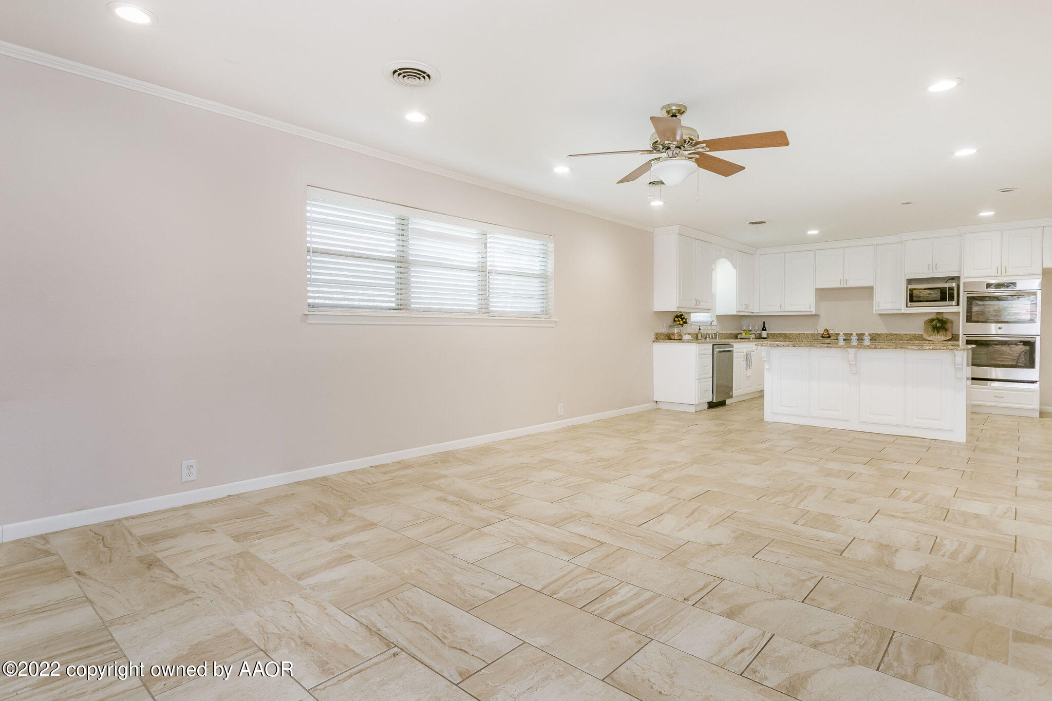 6107 Gainsborough Road Amarillo, TX 79106 - Photo 7 of 23 a view of a kitchen with a sink and microwave