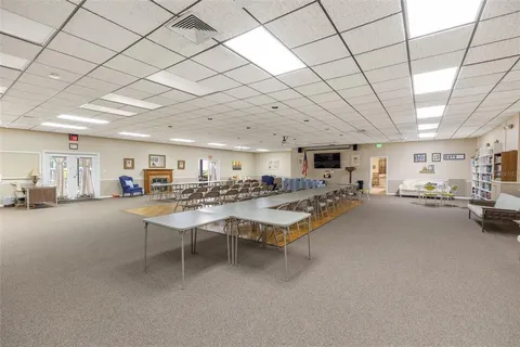 a living room with lots of furniture and a chandelier