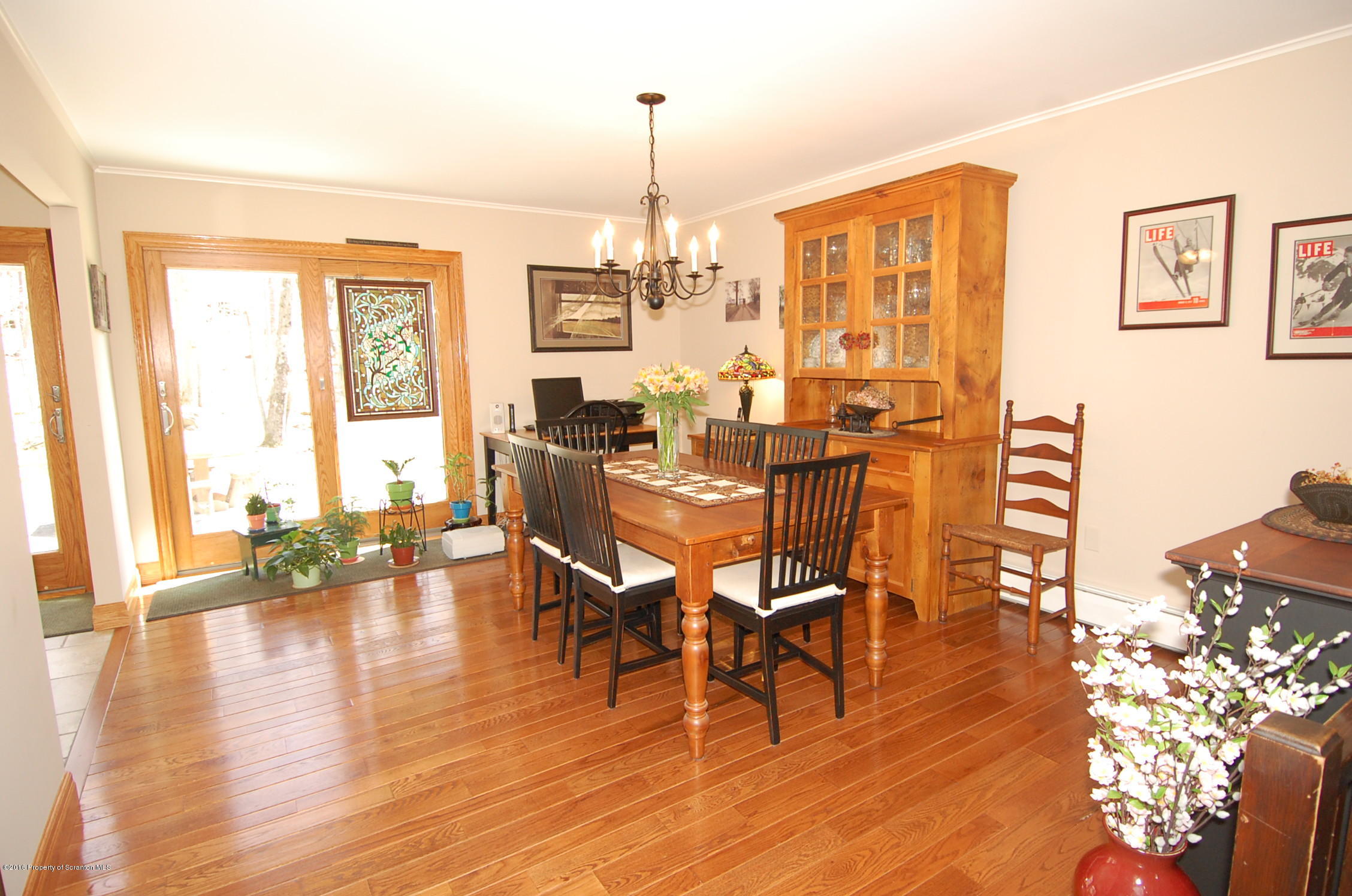60 Tinker Brook Road Forest City, PA 18421 - Photo 11 of 62 a view of a dining room with furniture window and wooden floor