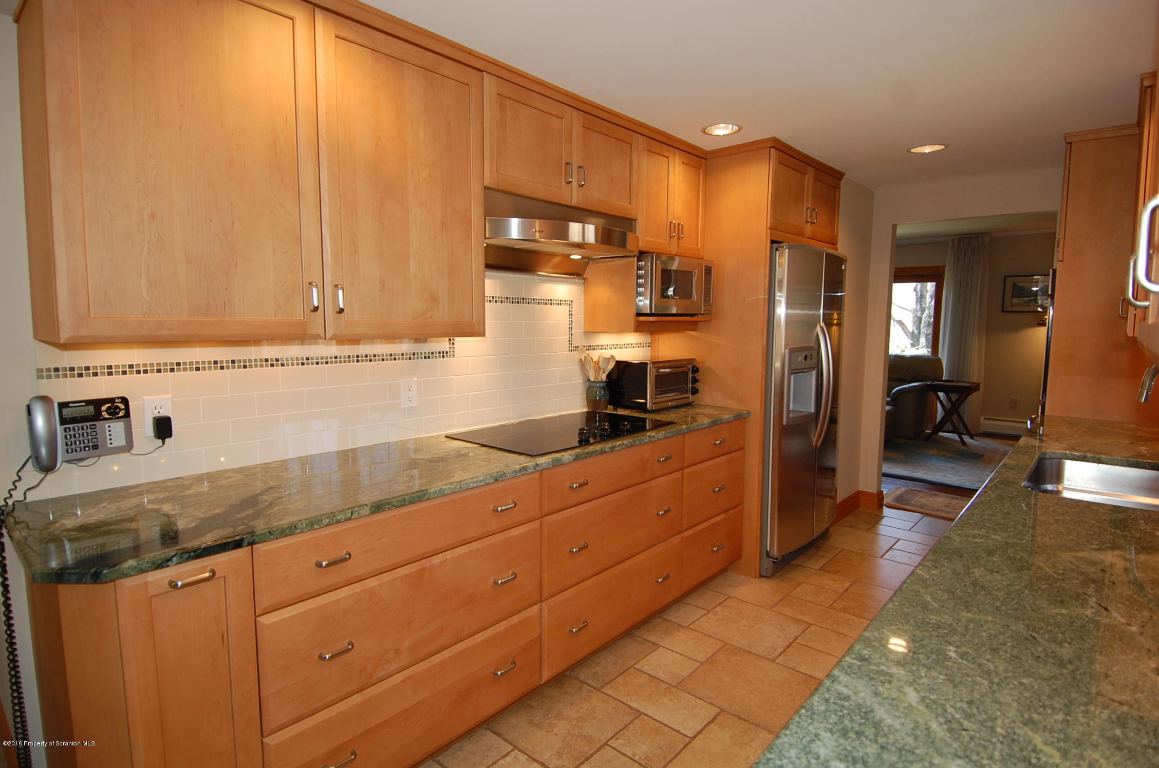 60 Tinker Brook Road Forest City, PA 18421 - Photo 3 of 62 a kitchen with stainless steel appliances granite countertop a refrigerator and a stove top oven
