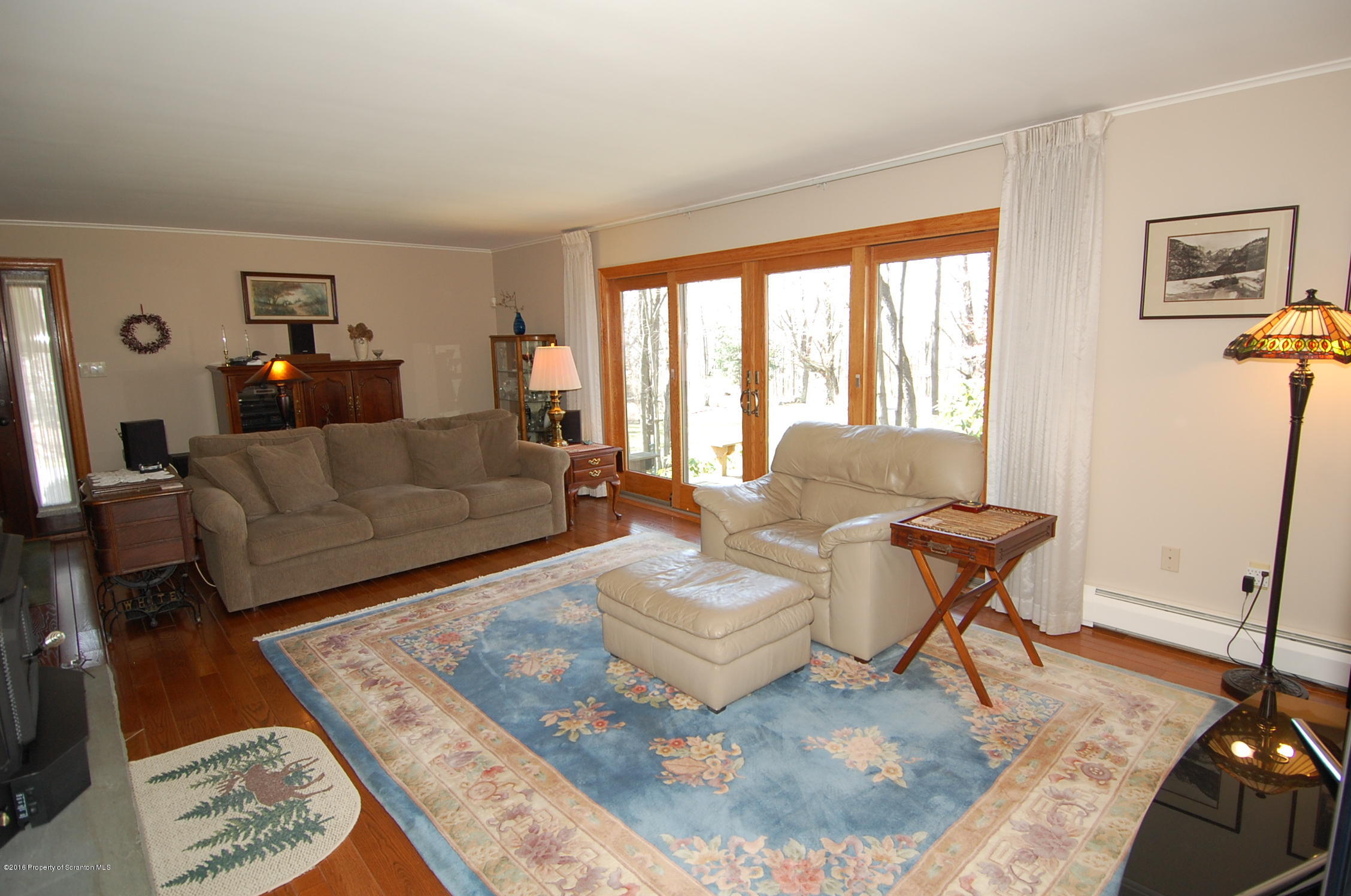 60 Tinker Brook Road Forest City, PA 18421 - Photo 8 of 62 a living room with furniture and a rug