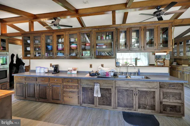 a kitchen with stainless steel appliances granite countertop a stove and cabinets
