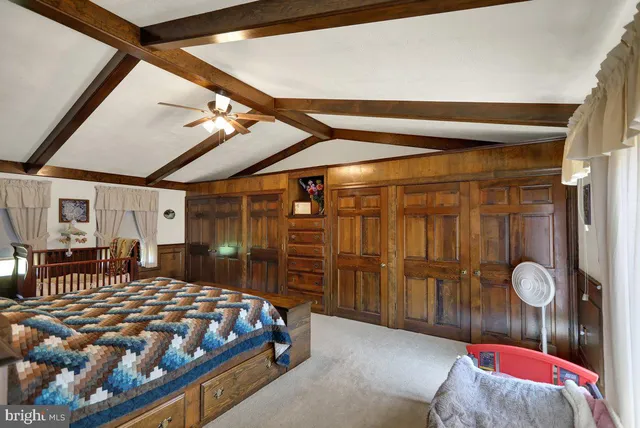 a bedroom with a bed and a table