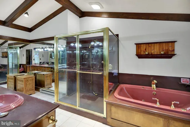 a bathroom with a sink a bath tub and shower
