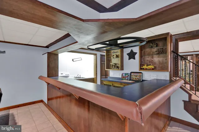 a view of kitchen with furniture and large windows