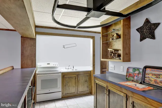 a utility room with a sink dryer and washer