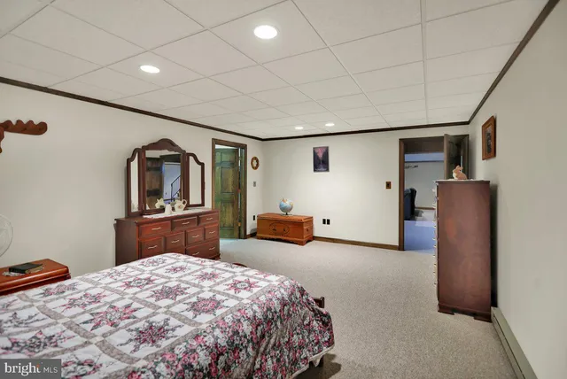 a bed room with a bed and dresser