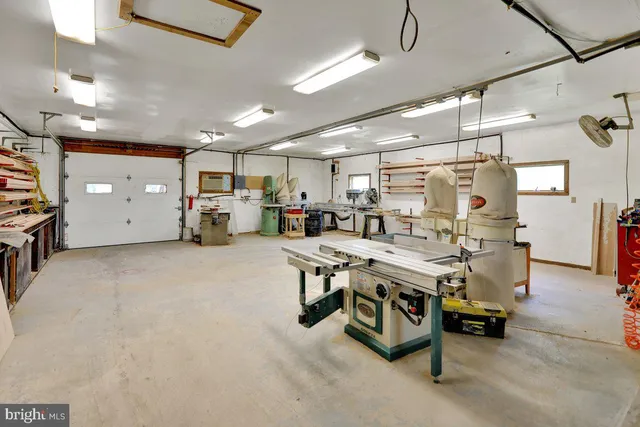 a view of a house with swimming pool and sitting area