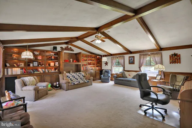 a bedroom with furniture and a window