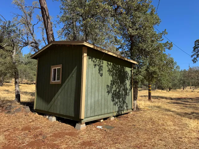 a view of a livingroom with furniture and a window