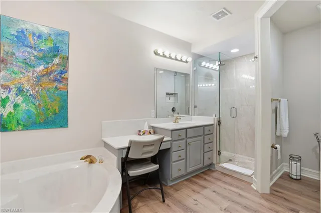 a bathroom with a bathtub shower sink and toilet