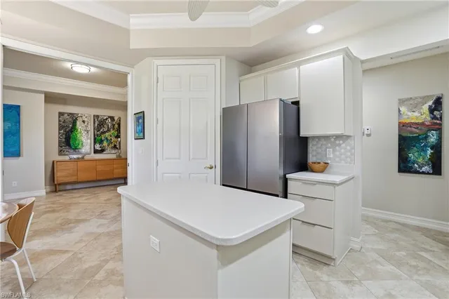 a kitchen with stainless steel appliances a refrigerator and a stove