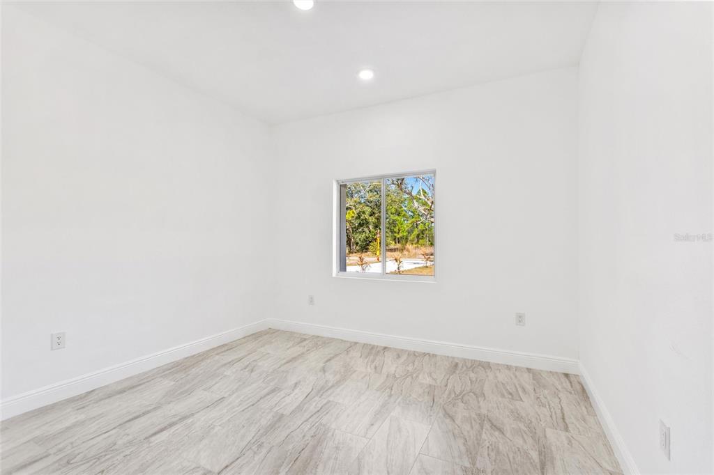 3121 Gardenia Drive Indian Lake Estates, FL 33855 - Photo 14 of 55 an empty room with a window