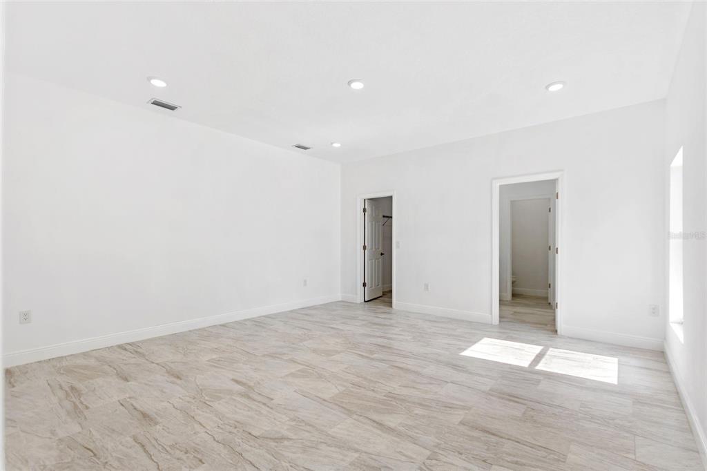 3121 Gardenia Drive Indian Lake Estates, FL 33855 - Photo 15 of 55 a view of an empty room with wooden floor
