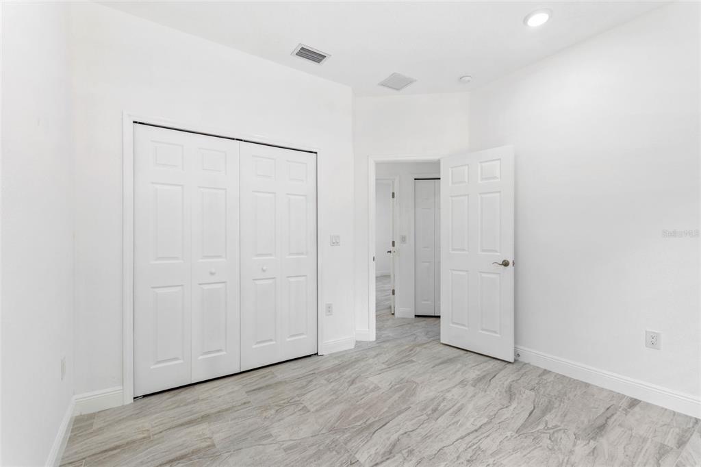 3121 Gardenia Drive Indian Lake Estates, FL 33855 - Photo 20 of 55 an empty room with wooden floor
