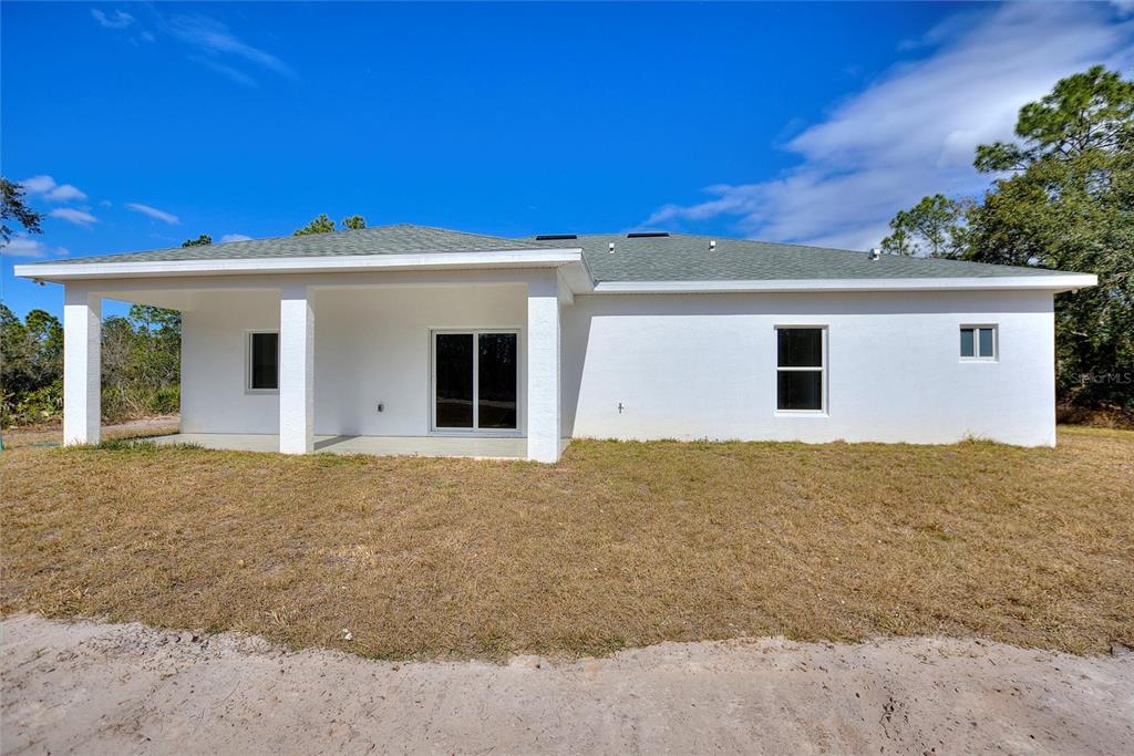 3121 Gardenia Drive Indian Lake Estates, FL 33855 - Photo 25 of 55 a view of an house with backyard space