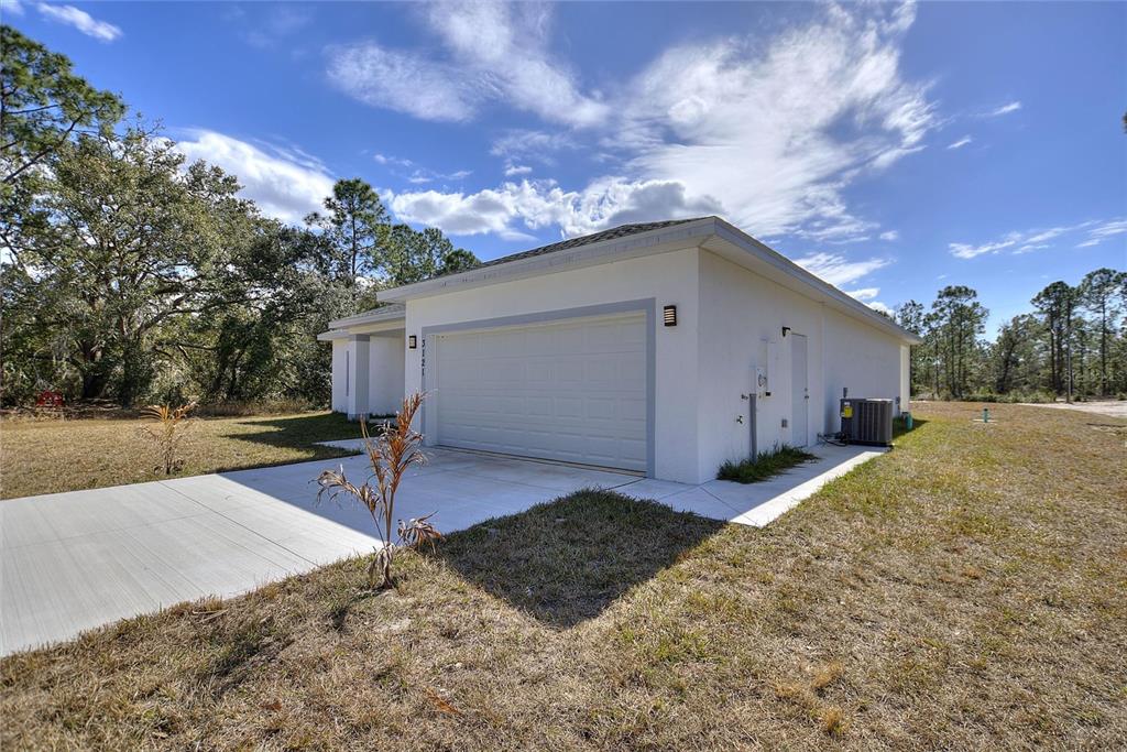 3121 Gardenia Drive Indian Lake Estates, FL 33855 - Photo 29 of 55 a view of a backyard with sitting area