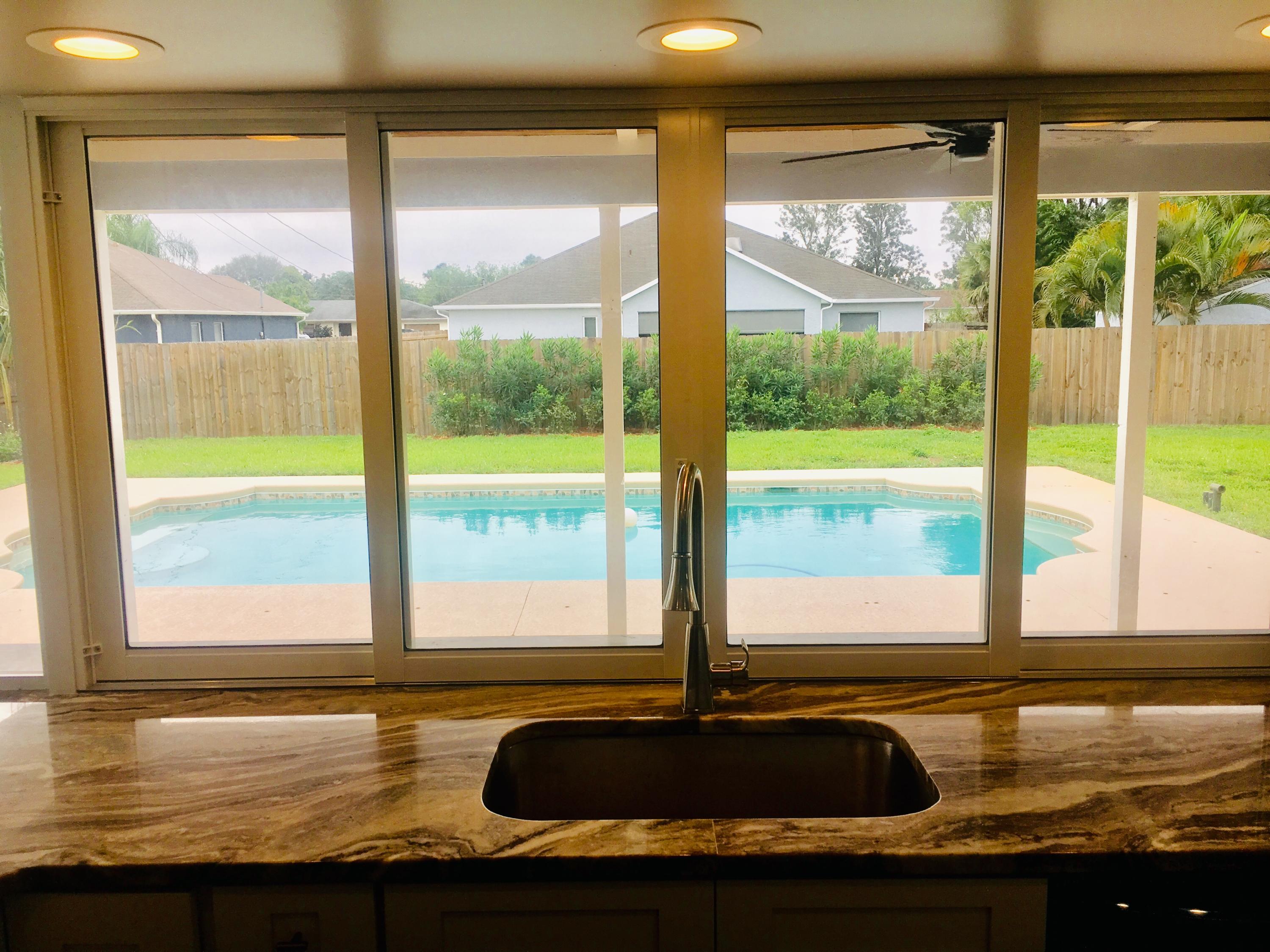 756 Southwest Ancona Road Port St. Lucie, FL 34953 - Photo 7 of 17 PASS THROUGH WINDOW
