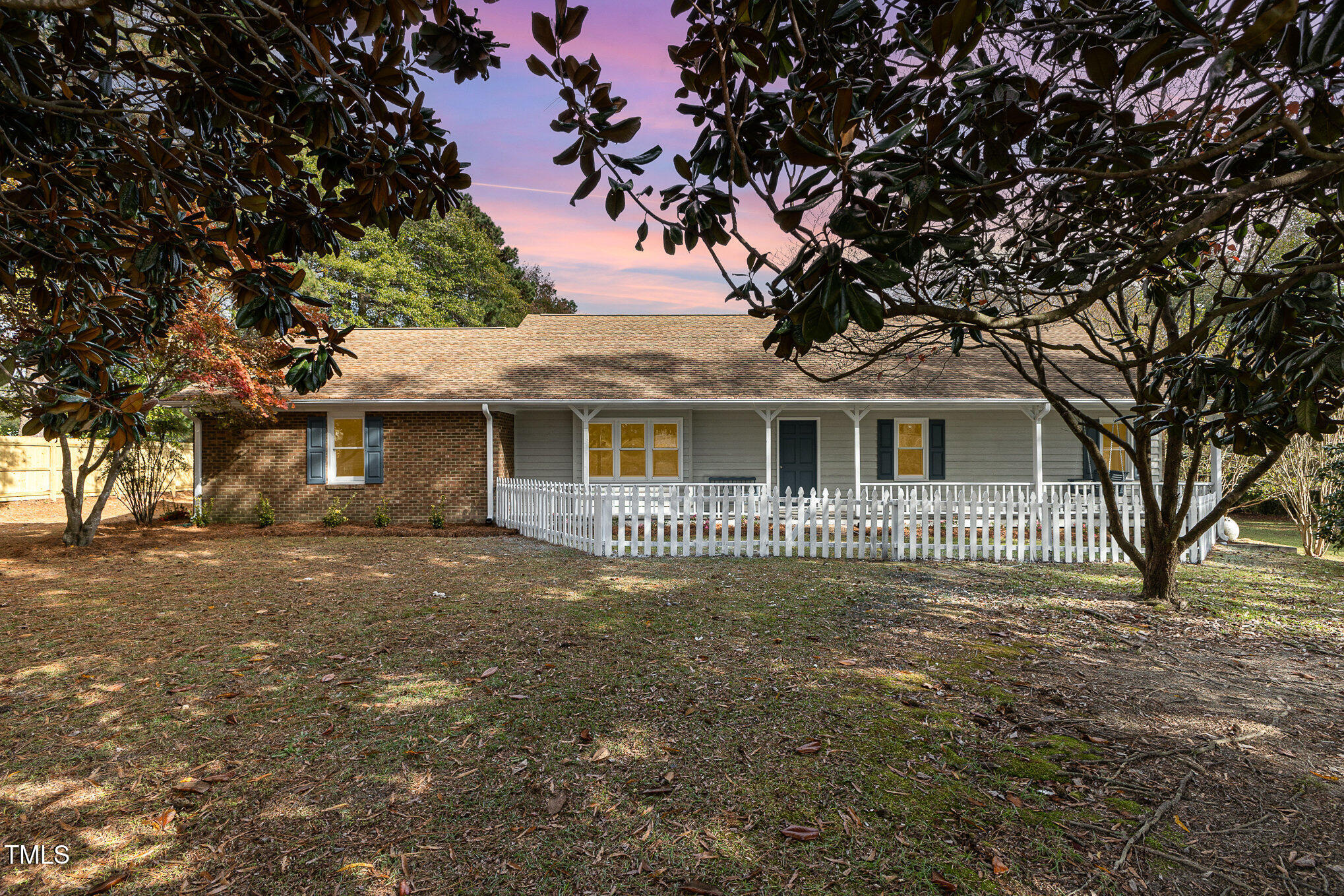 1046 Lipscomb Road Angier, NC 27501 - Photo 3 of 35 a front view of a house with a garden