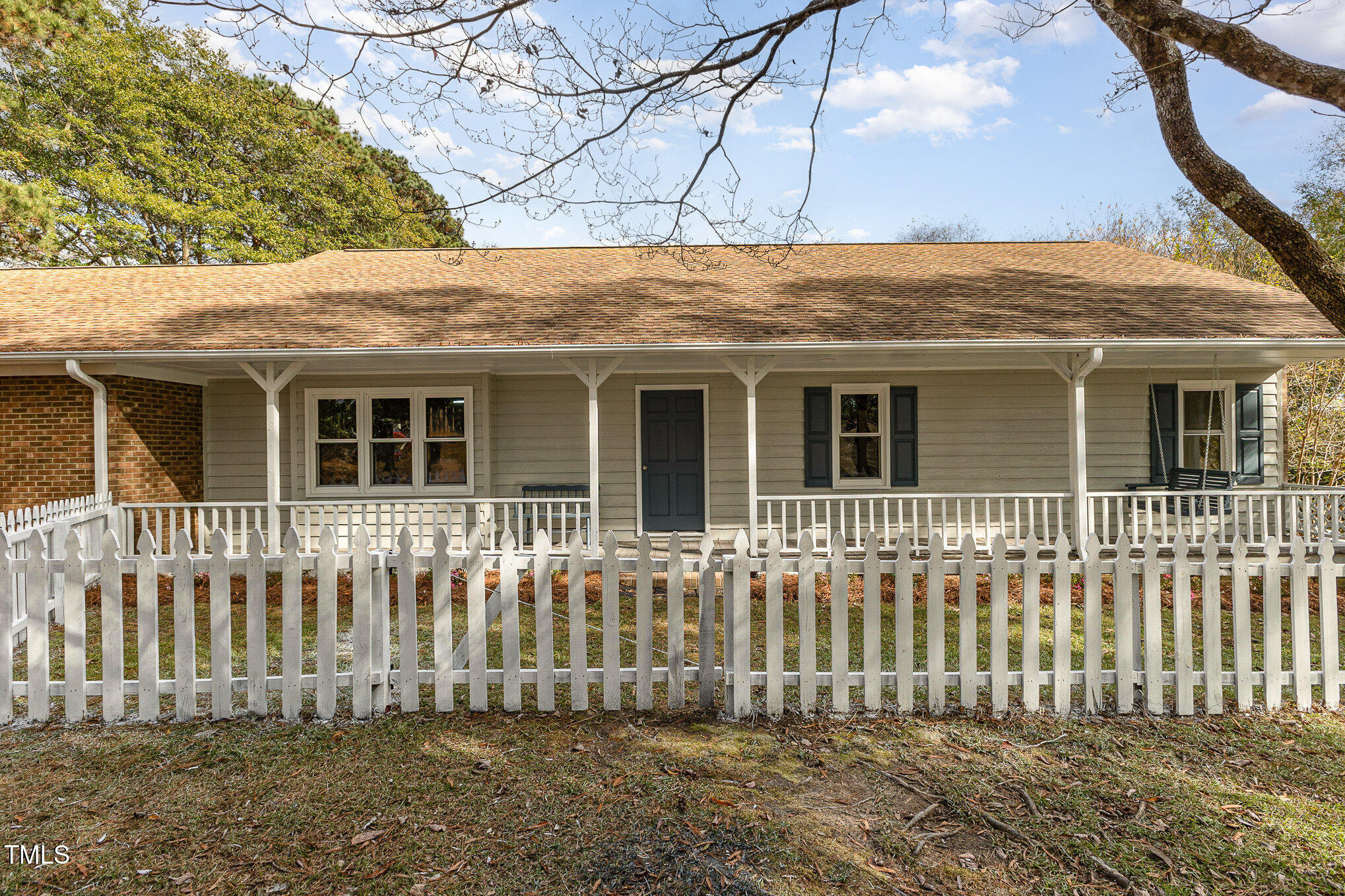 1046 Lipscomb Road Angier, NC 27501 - Photo 4 of 35 a front view of a house with a garden
