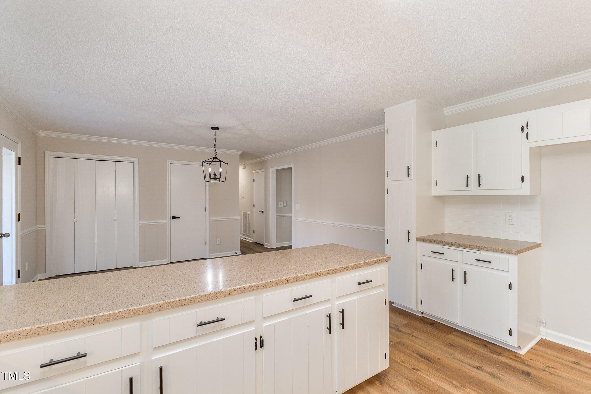 1046 Lipscomb Road Angier, NC 27501 - Photo 10 of 35 a kitchen with granite countertop white cabinets and white appliances