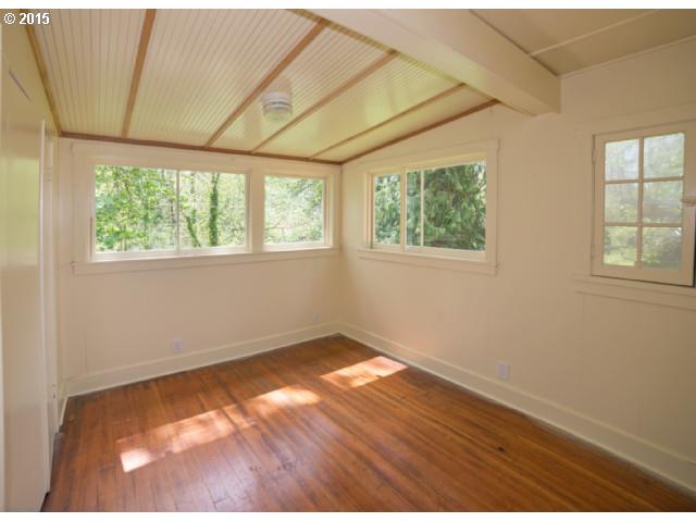 36526 Jasper Road Springfield, OR 97478 - Photo 12 of 16 an empty room with wooden floor and windows
