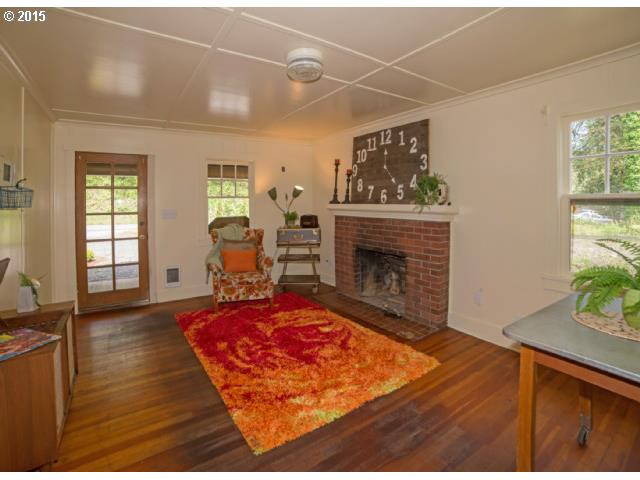 36526 Jasper Road Springfield, OR 97478 - Photo 4 of 16 a living room with furniture and a fireplace
