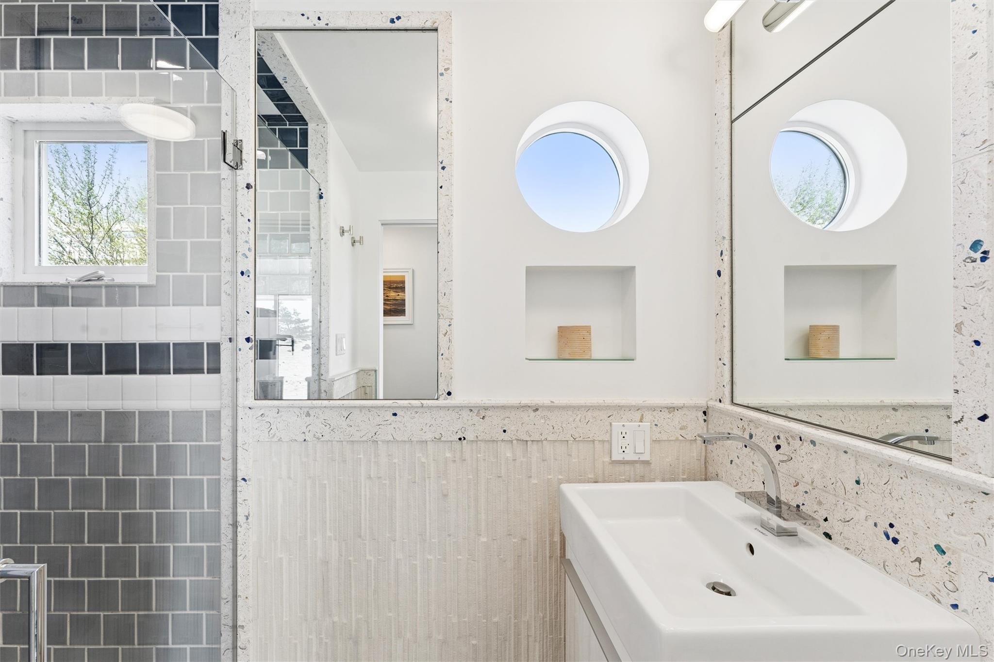 413 B Dune Road Westhampton Beach, NY 11978 - Photo 11 of 26 a bathroom with a sink and a mirror