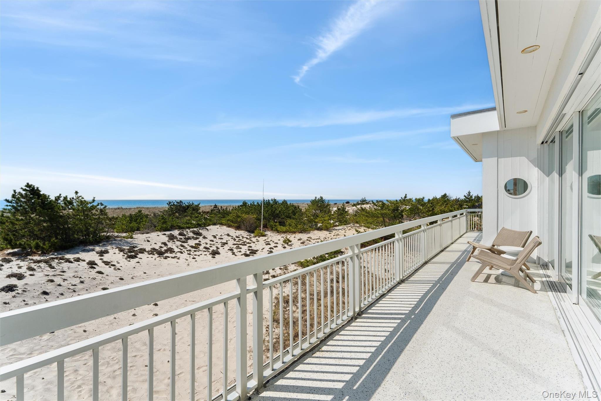 413 B Dune Road Westhampton Beach, NY 11978 - Photo 13 of 26 a view of balcony with wooden floor and city view