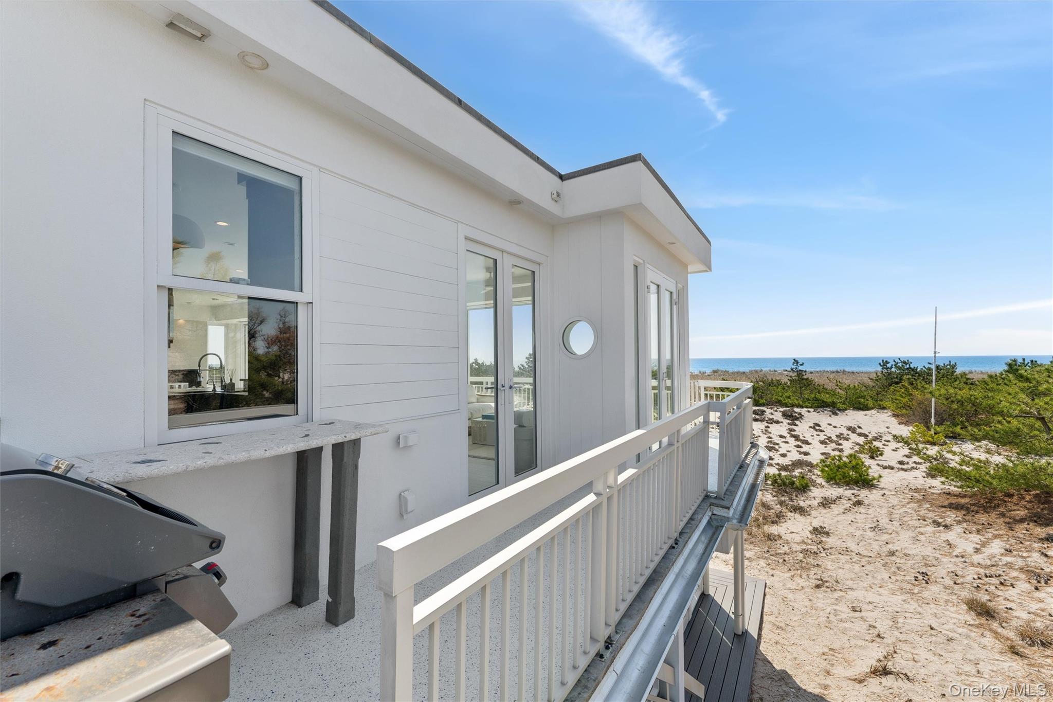 413 B Dune Road Westhampton Beach, NY 11978 - Photo 15 of 26 a view of balcony with furniture