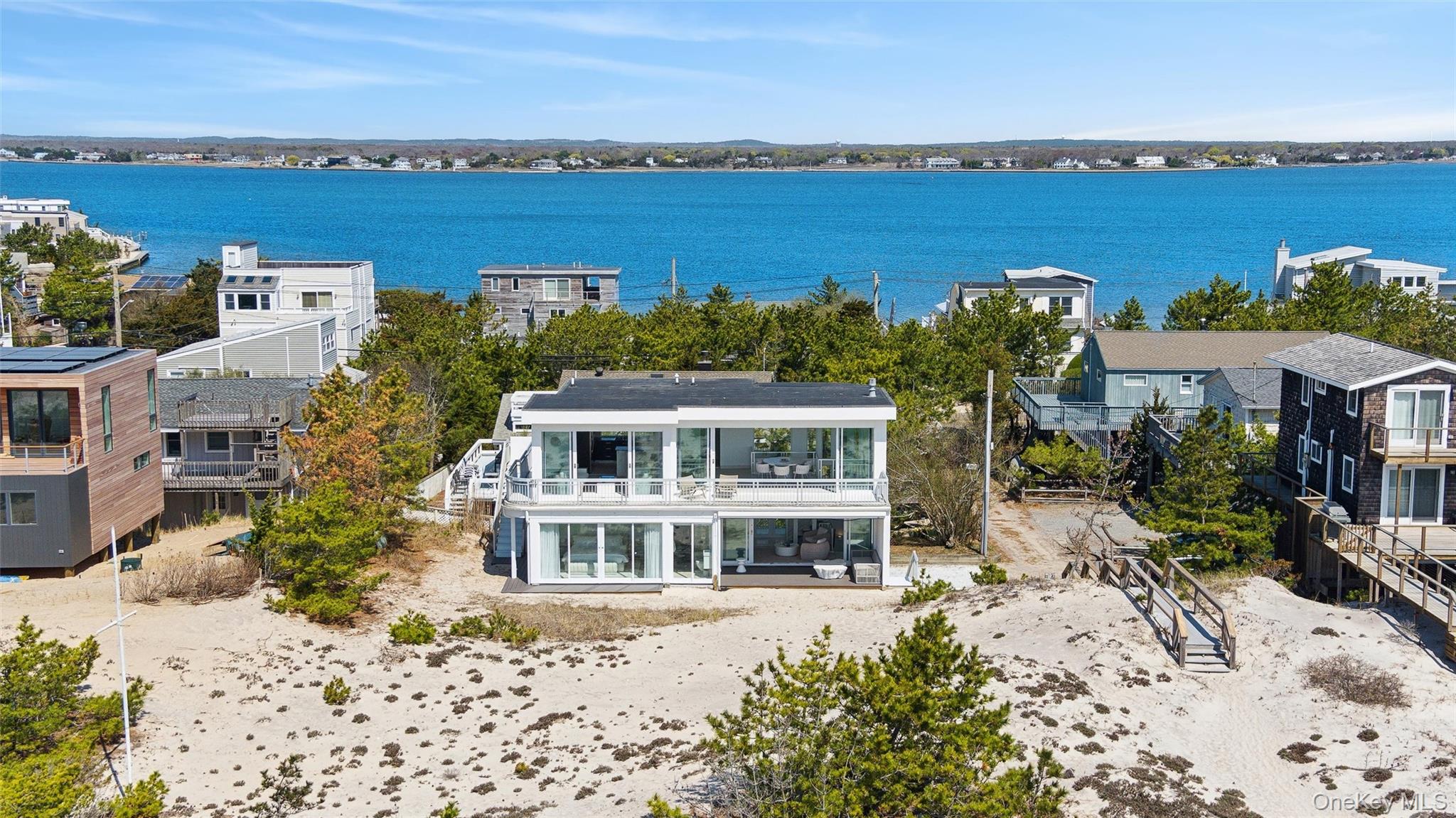 413 B Dune Road Westhampton Beach, NY 11978 - Photo 2 of 26 an aerial view of a house with a lake view