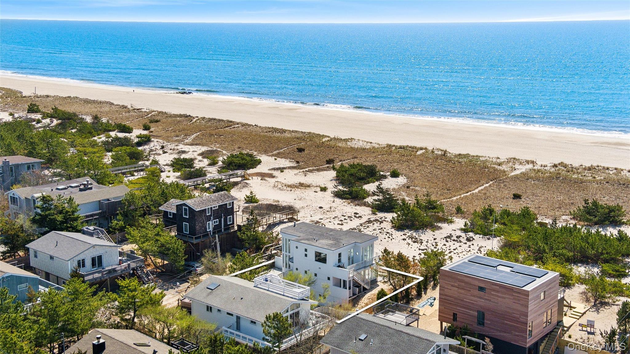 413 B Dune Road Westhampton Beach, NY 11978 - Photo 24 of 26 a view of city and ocean