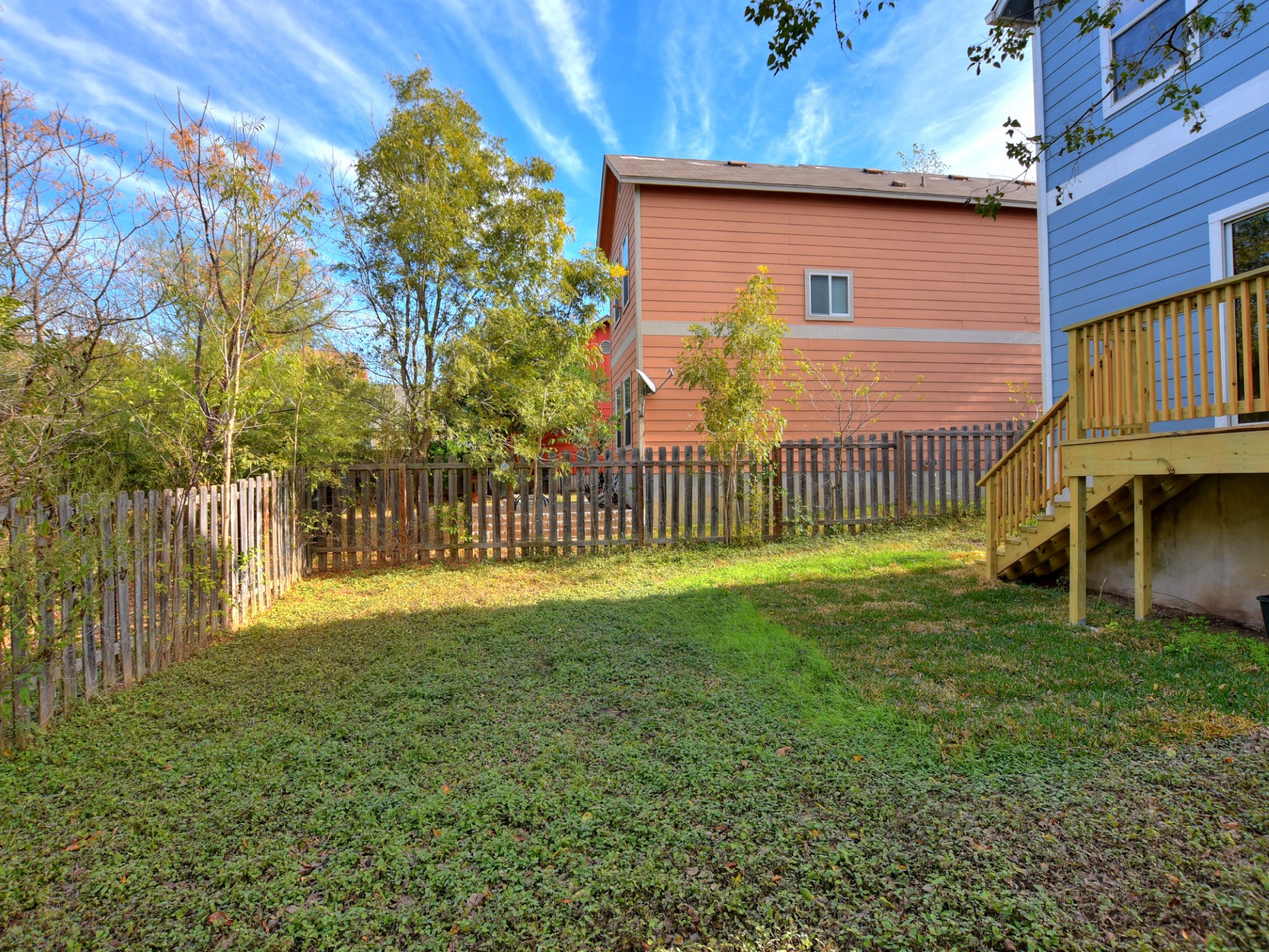 917 East 3rd Street Georgetown, TX 78626 - Photo 21 of 23 A fenced backyard offers a private green oasis for outdoor enjoyment.