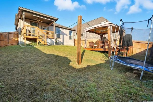 a view of a backyard with a patio