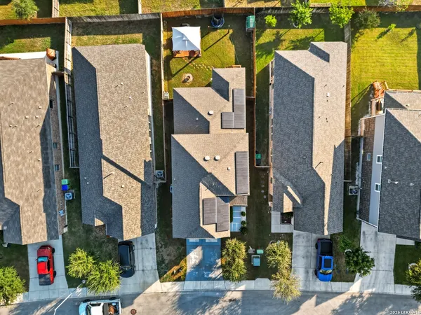 an aerial view of residential building and parking space