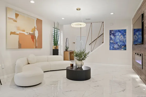 a kitchen with stainless steel appliances granite countertop a stove and a microwave