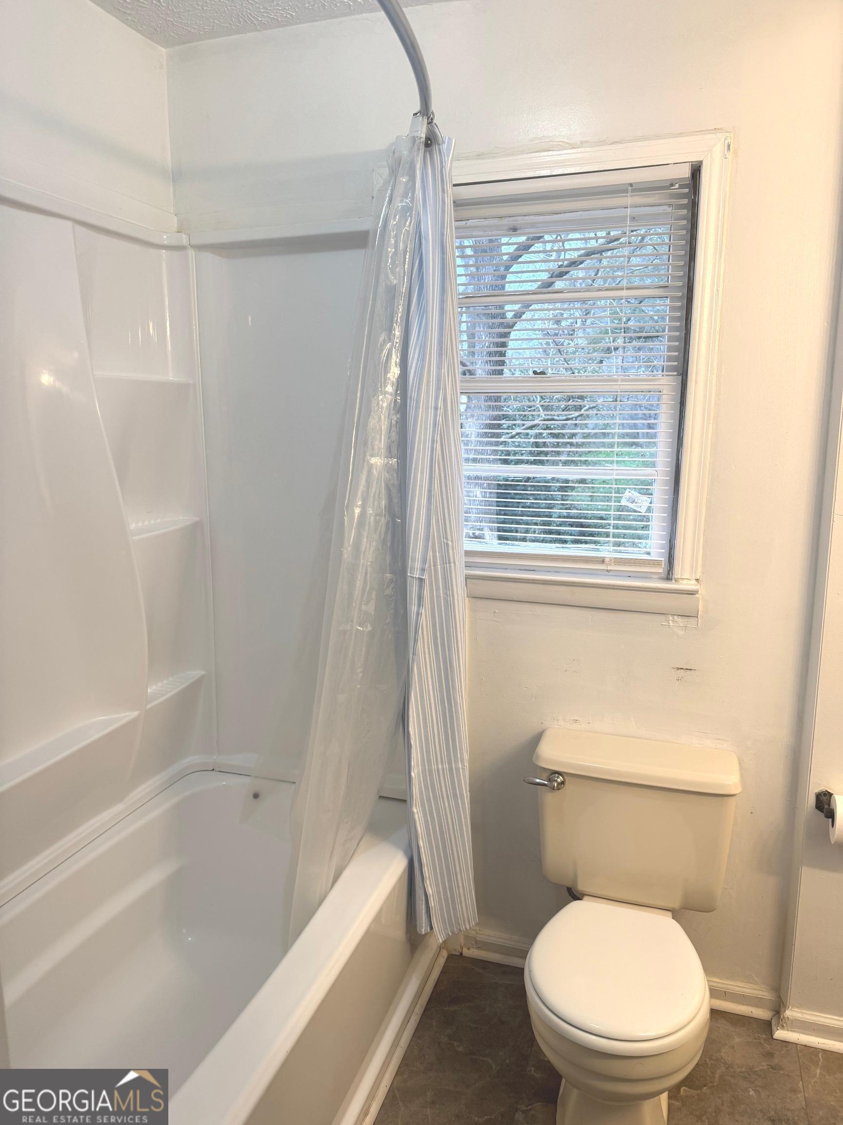 2308 Kelleytown Road McDonough, GA 30252 - Photo 13 of 13 a white toilet sitting next to a bath tub