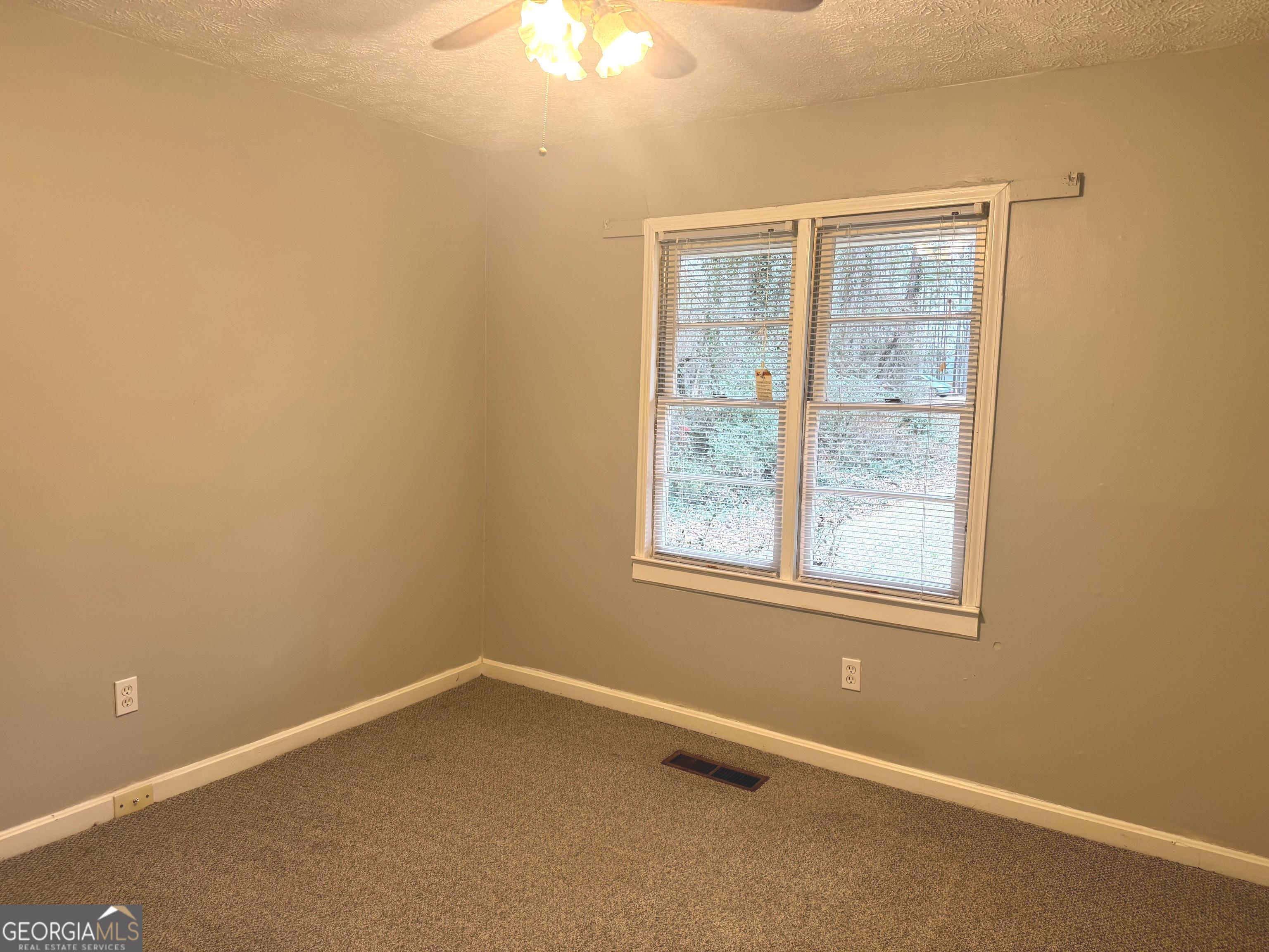2308 Kelleytown Road McDonough, GA 30252 - Photo 9 of 13 an empty room with a window