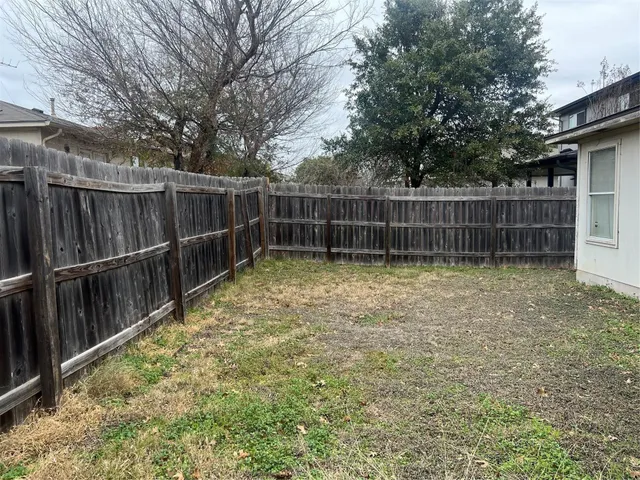 a view of a backyard with a small cabin