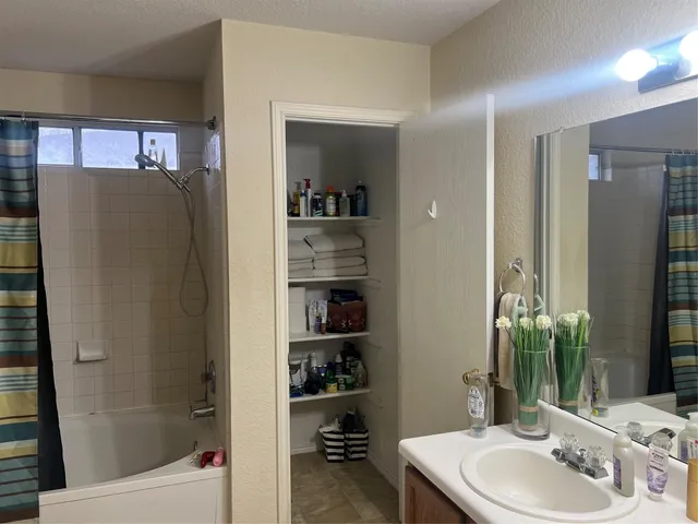 a bathroom with a bathtub and a sink